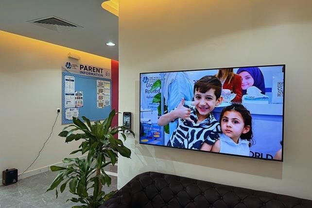 An interactive-panel classroom, fitted the same way in every room
